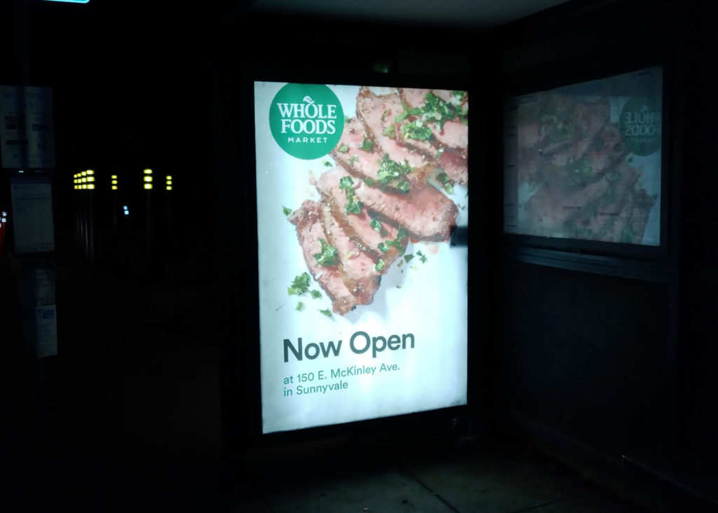 Whole Foods Bus Shelter Backlit at night - Out Of Home Graphics